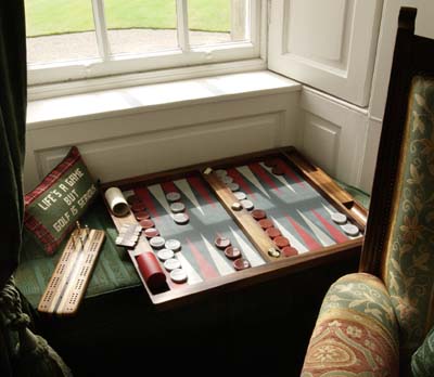 A game of Backgammon in the window seat in the study.